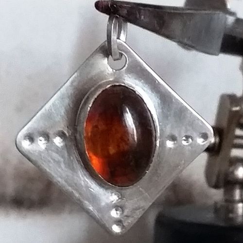 Contemporary handmade sterling silver amber bezel set pendant